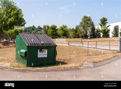 A Waste Management Garbage Dumpster Along East Waterfront Drive On A A Waste Management Garbage Dumpster Along East Waterfront Drive On A