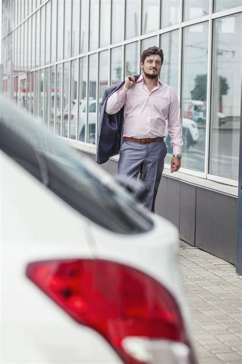 Businessman Man Goes To The Car In The Urban District Stock Photo Businessman Man Goes To The Car In The Urban District Stock Photo